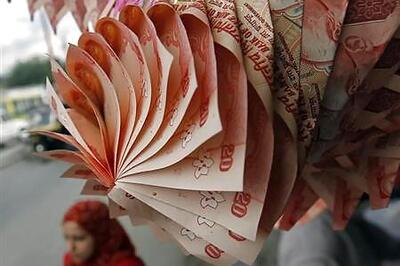 Rupee at two-week high, closes at 62.36 per US dollar