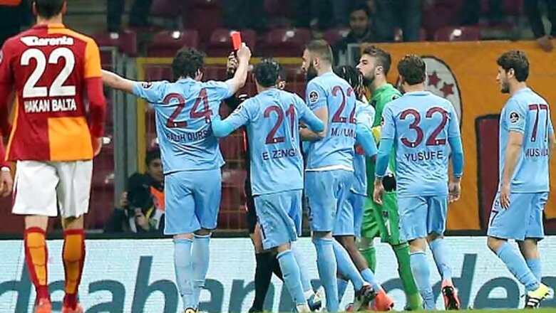 Watch: Footballer sent off for flashing red card to referee