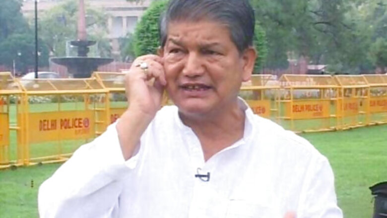 Harish Rawat's supporters celebrate anticipating his appointment as new CM