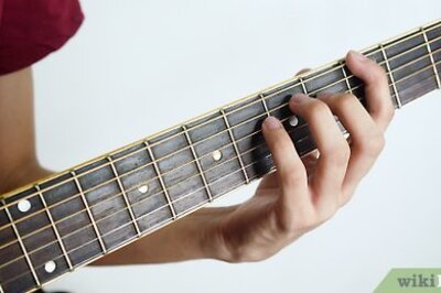 How to Hold a Guitar Neck