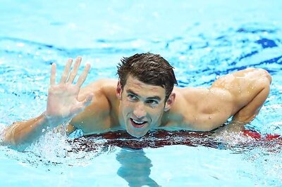 Phelps wins silver to equal medal haul record