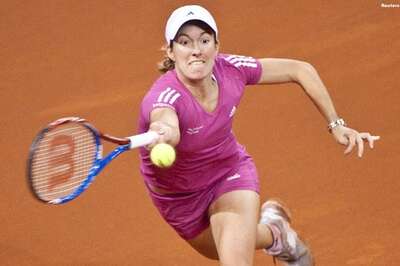 Henin stunned in Madrid, Sharapova bows out