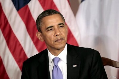 Obama flies to Afghanistan, signs pact with Karzai