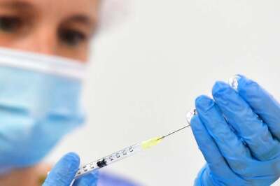 US Hits 70% Vaccination Rate a Month Late, Amid a Surge