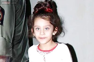 Snapshot: Awww! A shy Iqra Dutt poses with dad Sanjay Dutt's cut-out at the 'Ungli' screening