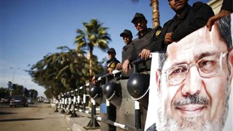 Mohamed Morsi faces trial as US reviews aid to Egypt