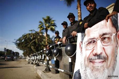 Mohamed Morsi faces trial as US reviews aid to Egypt