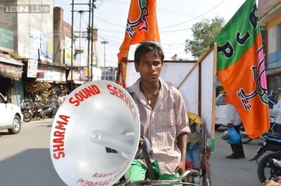 Rickshaw pullers carry around party messages on Karnal roads to earn daily bread