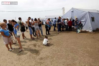 Dozens killed in attack on convoy, Ukraine says; rebels deny firing rocket