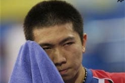 Defending men's champion out of TT singles