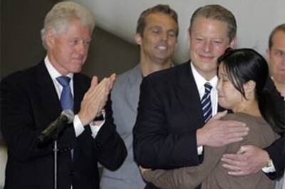 US journalists freed by N Korea return home