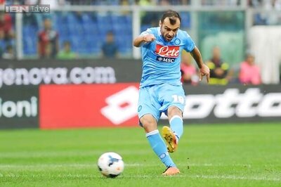 Napoli beat Genoa 2-0 to move top of Serie A