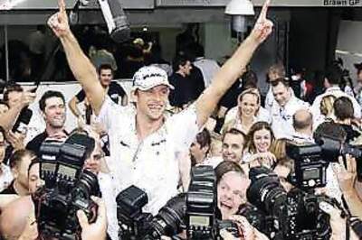 Button celebrates title, calls himself champion