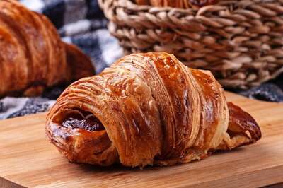 Woman Cuts World's 'Biggest’ Pain Au Chocolat; Internet Thinks It’s ‘Too Much Pain, Too Little Chocolate'