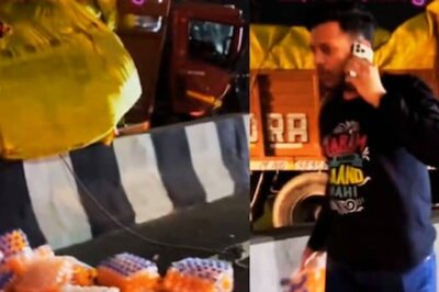Man Speaking On IPhone Steals Soft Drinks From Overturned Truck, Internet Calls Him ‘Shameless’