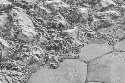 NASA releases sharpest images ever of Pluto's cratered, icy surface
