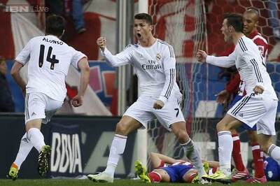 Ronaldo rescues Madrid at Atletico, Barcelona hammer Almeria