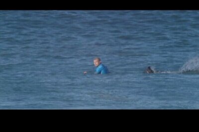Australian surfing champion wrestles a shark on live television in South Africa