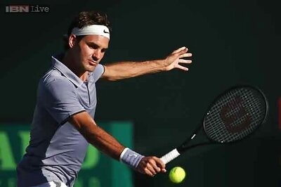 Roger Federer through to Halle semis after Lu pulls out
