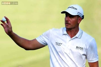 Sizzling Stenson one ahead, Woods battles to a 73