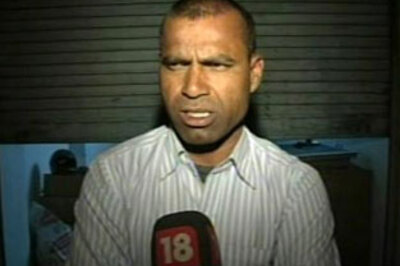 National Archery coach forced to live in garage