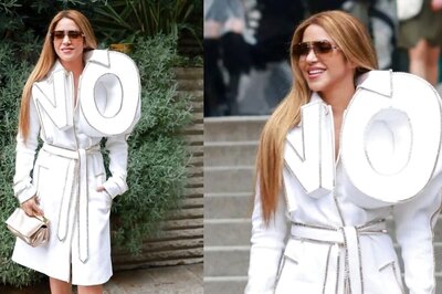 Shakira Makes a Bold Statement in a ‘NO’ Trench Coat at the Haute Couture Fashion Week