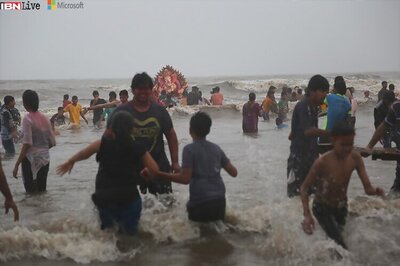 Devotees dance, perform aarti and take photos as they bid farewell to Lord Ganesha