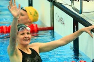 Coventry wins 200m backstroke in world record time