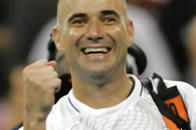 Aggasi staves off retirement with win