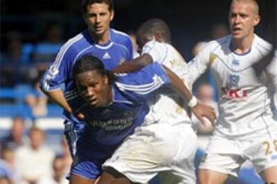 Chelsea go on top as Gunners tame Man City