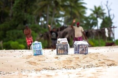 Giant SOS on Pacific isle leads to rescue of three stranded sailors