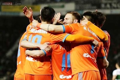 Third-placed Valencia surge four points clear of Atletico Madrid